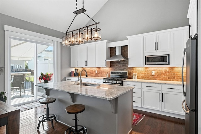1416 Commons Ln, South Fayette, PA 15017 - kitchen featuring wall chimney exhaust hood, stainless steel appliances, decorative backsplash, dark wood finished floors, and white cabinets