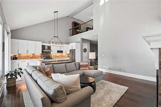 1416 Commons Ln, South Fayette, PA 15017 - living area with high vaulted ceiling, dark wood finished floors, beamed ceiling, and a chandelier
