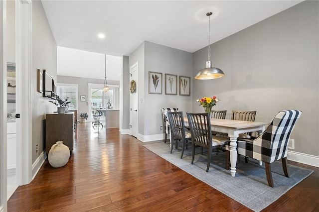 1416 Commons Ln, South Fayette, PA 15017 - dining area featuring dark wood-type flooring and baseboards