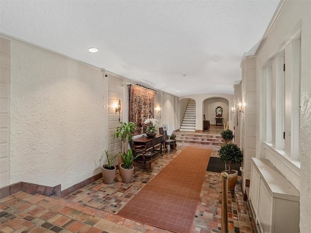 166 N Dithridge St Unit 3E, Oakland, PA 15213 - hall with arched walkways, a textured wall, recessed lighting, and stairway