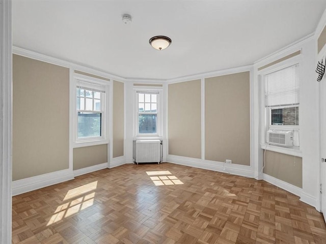 166 N Dithridge St Unit 3E, Oakland, PA 15213 - empty room with radiator, cooling unit, ornamental molding, and a smoke detector