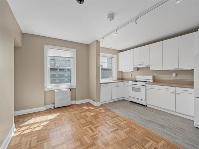 166 N Dithridge St Unit 3E, Oakland, PA 15213 - kitchen featuring white appliances, radiator heating unit, white cabinets, and light countertops