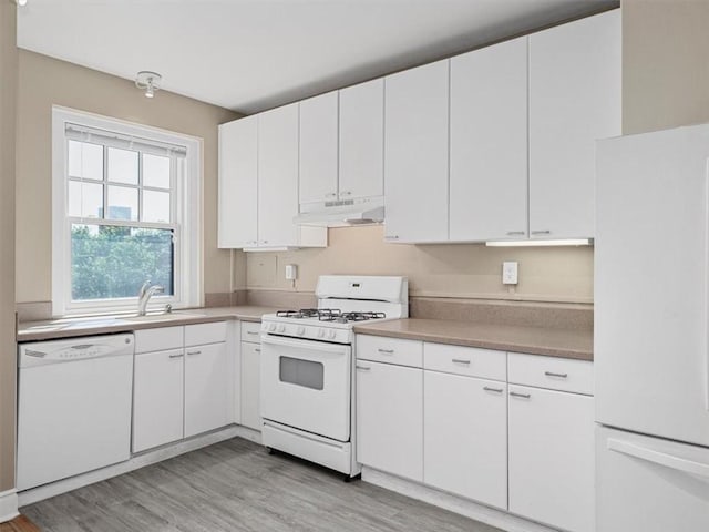 166 N Dithridge St Unit 3E, Oakland, PA 15213 - kitchen featuring white appliances, under cabinet range hood, light wood finished floors, and white cabinetry