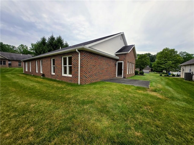 3205 Penny Ln, Neshannock Twp, PA 16105 - view of side of home with brick siding, a yard, and a patio area