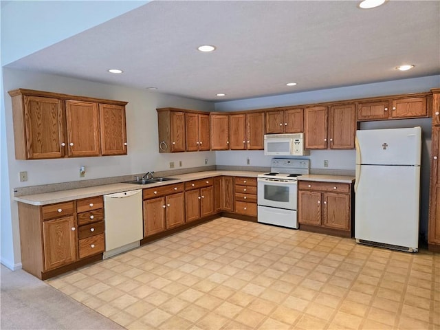3205 Penny Ln, Neshannock Twp, PA 16105 - kitchen featuring white appliances, brown cabinetry, light countertops, recessed lighting, and light floors