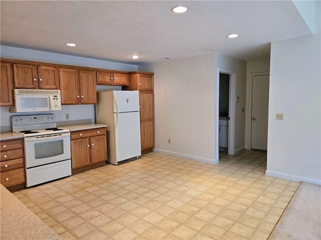 3205 Penny Ln, Neshannock Twp, PA 16105 - kitchen featuring white appliances, light countertops, brown cabinets, and recessed lighting