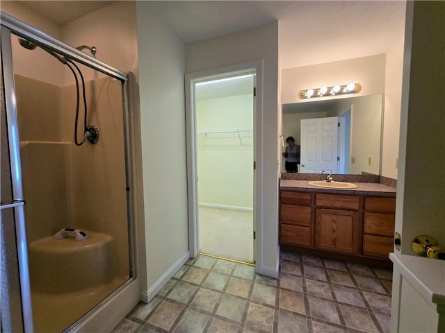 3205 Penny Ln, Neshannock Twp, PA 16105 - bathroom featuring a shower stall, vanity, and a walk in closet