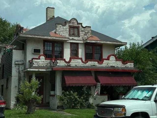 3604 Brighton Rd, E Pittsburgh, PA 15212 - rear view of property with stucco siding and a chimney