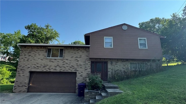 495 Pierson Run Rd, Plum Boro, PA 15239 - tri-level home featuring an attached garage, brick siding, a front lawn, and driveway