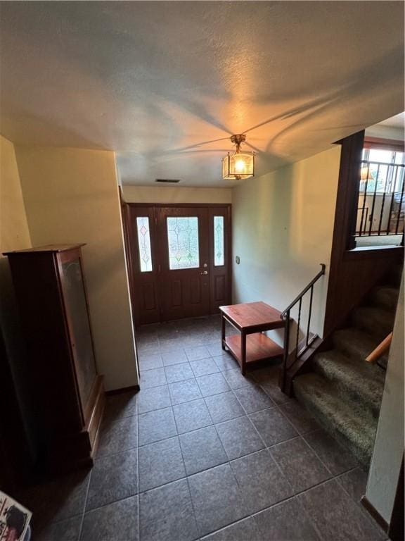 495 Pierson Run Rd, Plum Boro, PA 15239 - foyer with stairs and dark tile patterned floors