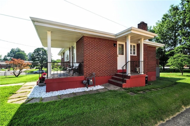 6437 Willem, Jefferson Hills, PA 15332 - view of home's exterior with a chimney, a lawn, and brick siding