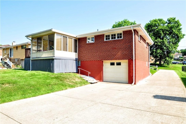 6437 Willem, Jefferson Hills, PA 15332 - view of front of home with concrete driveway, a sunroom, a front yard, and an attached garage