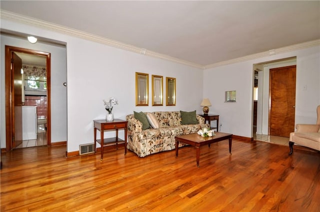 6437 Willem, Jefferson Hills, PA 15332 - living room featuring light wood finished floors and crown molding