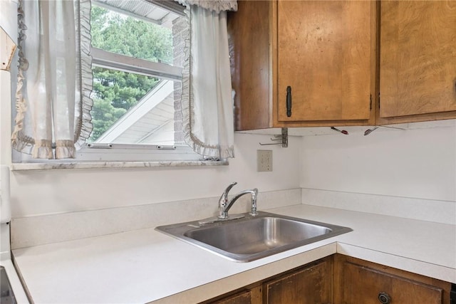 409 Westland Dr, Hempfield Twp, PA 15601 - kitchen featuring light countertops and brown cabinetry