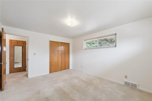 409 Westland Dr, Hempfield Twp, PA 15601 - unfurnished bedroom featuring a closet and light carpet