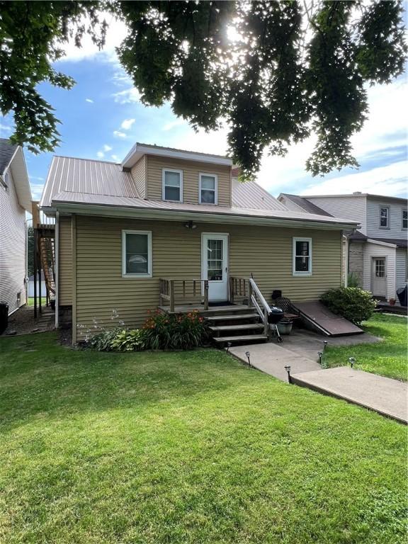 613 Third St, City Of But Ne, PA 16001 - back of property featuring a lawn and a metal roof