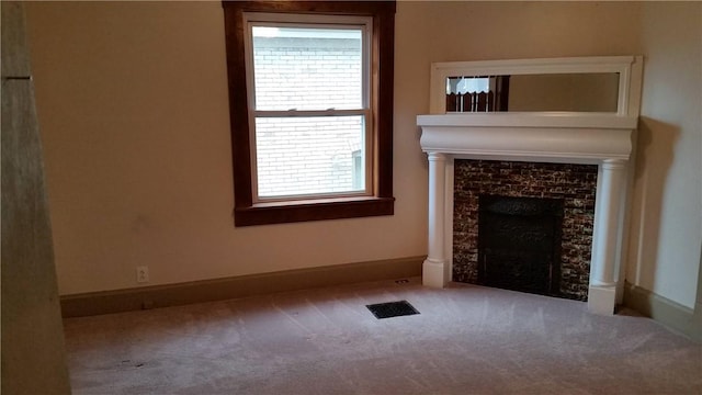 613 Third St, City Of But Ne, PA 16001 - unfurnished living room with carpet flooring, healthy amount of natural light, and a tile fireplace