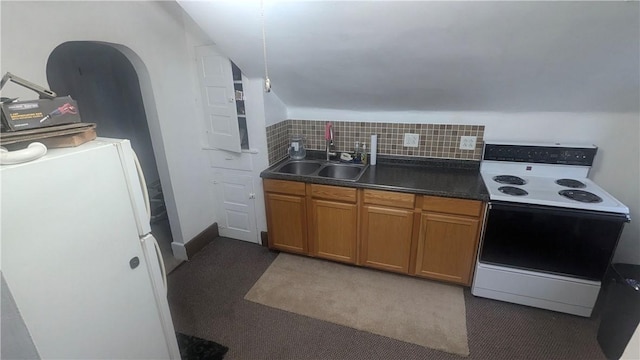 613 Third St, City Of But Ne, PA 16001 - kitchen with white range with electric cooktop, brown cabinets, dark countertops, decorative backsplash, and washer / dryer