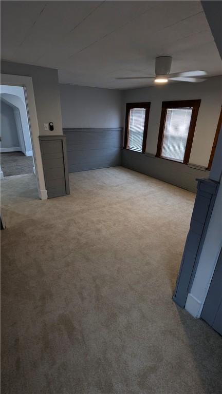 613 Third St, City Of But Ne, PA 16001 - carpeted spare room with a ceiling fan and a wainscoted wall