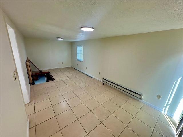1023 Burtner Rd, Harrison Twp, PA 15065 - spare room featuring a baseboard radiator, a textured ceiling, and light tile patterned flooring