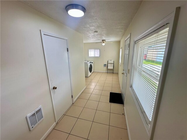 1023 Burtner Rd, Harrison Twp, PA 15065 - laundry room with washing machine and clothes dryer, a textured ceiling, light tile patterned floors, and ceiling fan