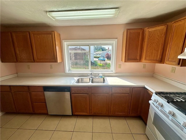 1023 Burtner Rd, Harrison Twp, PA 15065 - kitchen with dishwasher, gas range gas stove, and brown cabinets