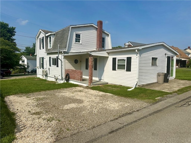 1023 Burtner Rd, Harrison Twp, PA 15065 - colonial inspired home with a gambrel roof, a chimney, a porch, a shingled roof, and a front yard