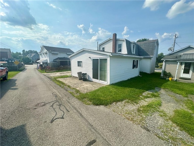 1023 Burtner Rd, Harrison Twp, PA 15065 - back of house with a gambrel roof, a residential view, a chimney, and a shingled roof