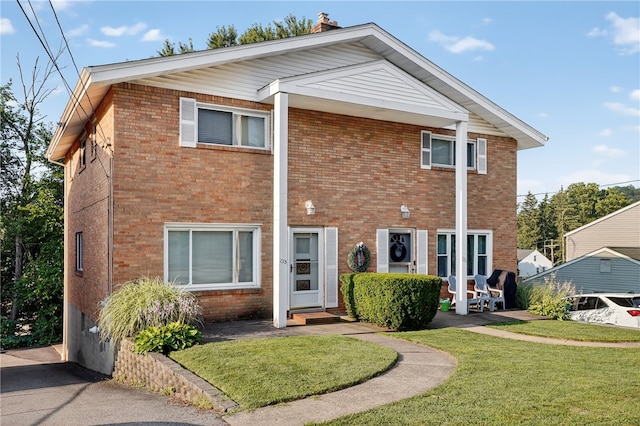 233 Ingram Ave, Ingram, PA 15205 - view of front of house with a front yard and brick siding