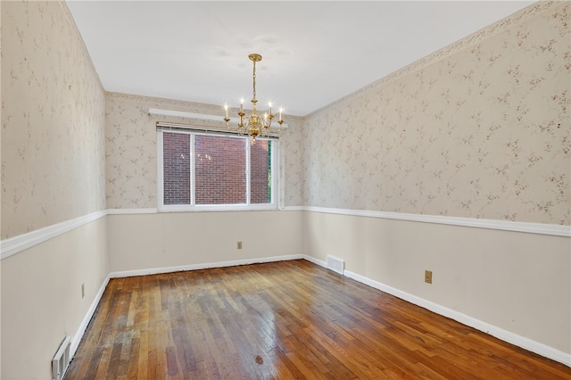 233 Ingram Ave, Ingram, PA 15205 - empty room with hardwood / wood-style floors and a chandelier
