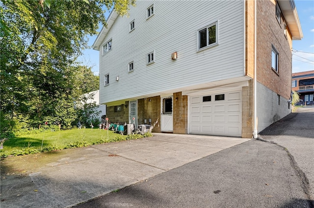 233 Ingram Ave, Ingram, PA 15205 - view of front facade featuring an attached garage, a front yard, and driveway