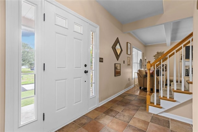 405 Crestridge Dr, Hempfield Twp, PA 15601 - foyer with stairs, beam ceiling, and dark stone finish flooring