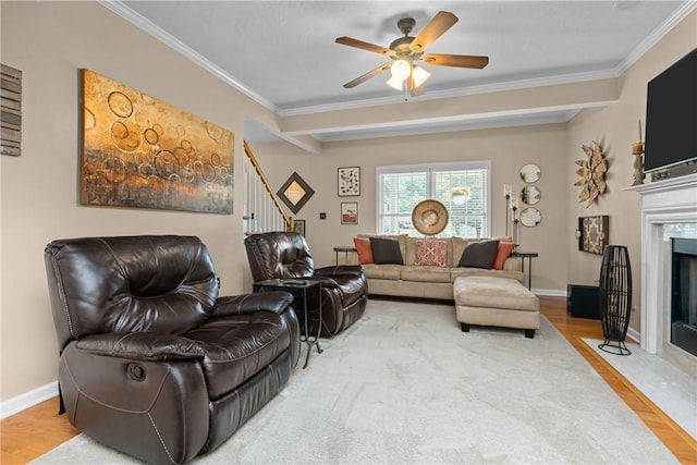 405 Crestridge Dr, Hempfield Twp, PA 15601 - living area with stairs, wood finished floors, a fireplace, ornamental molding, and a ceiling fan