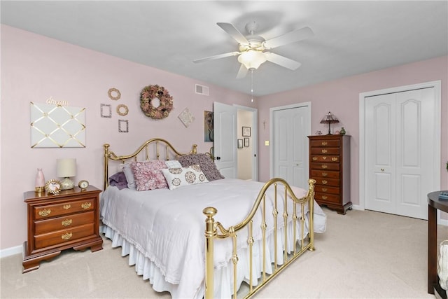 405 Crestridge Dr, Hempfield Twp, PA 15601 - bedroom with multiple closets, light colored carpet, and a ceiling fan