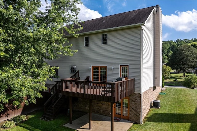 405 Crestridge Dr, Hempfield Twp, PA 15601 - back of property featuring a lawn, a patio, a chimney, a deck, and stairs