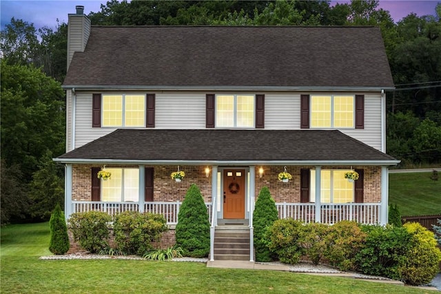 405 Crestridge Dr, Hempfield Twp, PA 15601 - view of front of house featuring a chimney, a porch, and brick siding