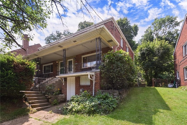 3905 Beechwood Blvd, Squirrel Hill, PA 15217 - view of front facade featuring brick siding, a front lawn, stairs, a chimney, and a balcony