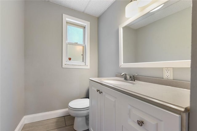 3905 Beechwood Blvd, Squirrel Hill, PA 15217 - half bathroom featuring vanity, wood finished floors, and a drop ceiling
