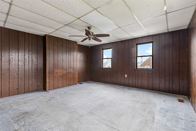 149 Frank St, Whitaker, PA 15120 - spare room with a drop ceiling, carpet floors, a ceiling fan, and wooden walls
