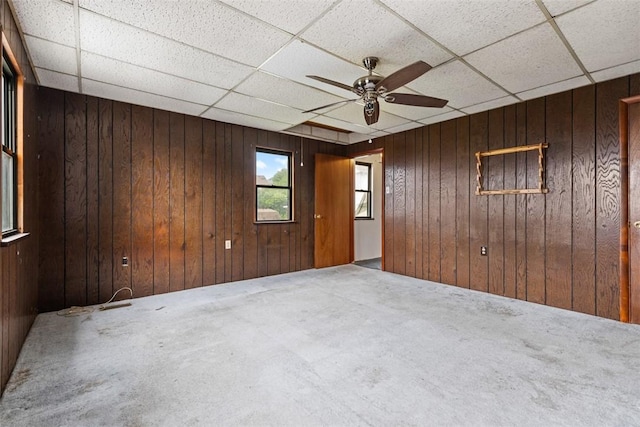 149 Frank St, Whitaker, PA 15120 - carpeted empty room featuring ceiling fan, wooden walls, and a drop ceiling