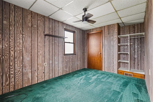 149 Frank St, Whitaker, PA 15120 - unfurnished bedroom featuring wood walls, a drop ceiling, and carpet