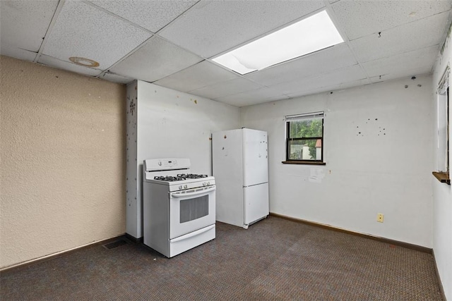 149 Frank St, Whitaker, PA 15120 - kitchen with white appliances, a drop ceiling, and dark carpet