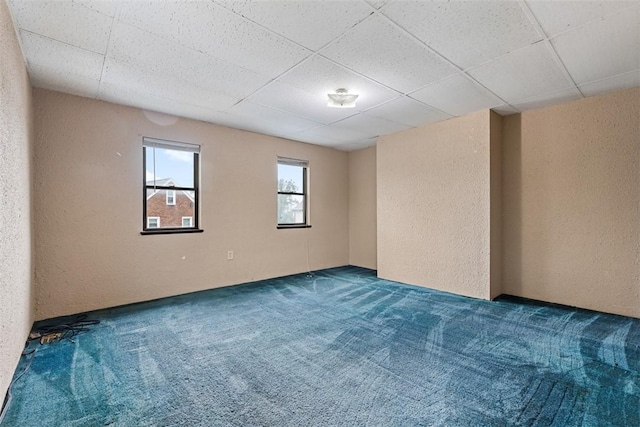 149 Frank St, Whitaker, PA 15120 - carpeted empty room with a textured wall and a drop ceiling