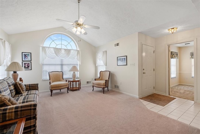 5113 Polo Fields Dr, Hampton, PA 15044 - sitting room featuring carpet, ceiling fan, tile patterned floors, vaulted ceiling, and a textured ceiling