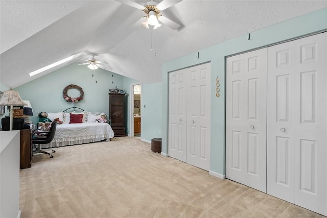 5113 Polo Fields Dr, Hampton, PA 15044 - bedroom with carpet flooring, multiple closets, vaulted ceiling, a skylight, and a textured ceiling