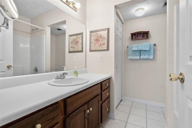 5113 Polo Fields Dr, Hampton, PA 15044 - bathroom with vanity, a textured ceiling, tile patterned flooring, and a shower