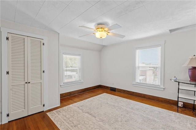 107 Braun St, Shaler, PA 15223 - unfurnished bedroom with wood finished floors, a closet, and a ceiling fan