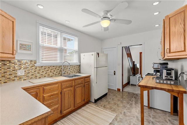 107 Braun St, Shaler, PA 15223 - kitchen with freestanding refrigerator, light countertops, backsplash, recessed lighting, and ceiling fan
