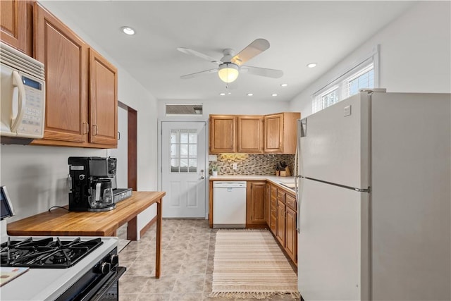107 Braun St, Shaler, PA 15223 - kitchen featuring white appliances, a ceiling fan, light countertops, decorative backsplash, and recessed lighting