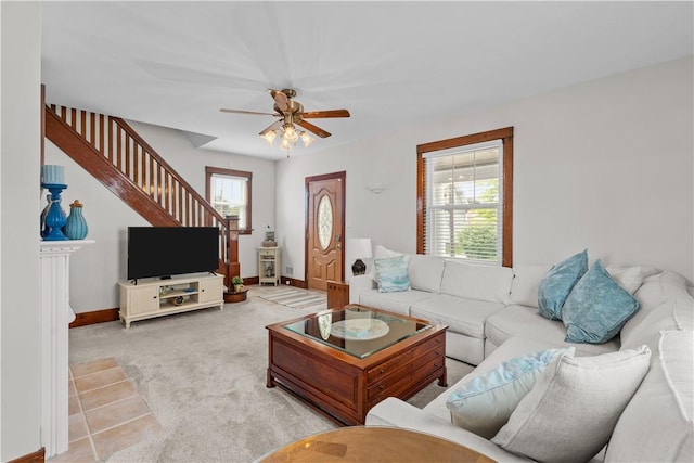 107 Braun St, Shaler, PA 15223 - living area featuring stairs, light carpet, and ceiling fan